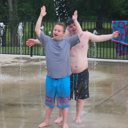 Two SCAMPers enjoying the splash pad